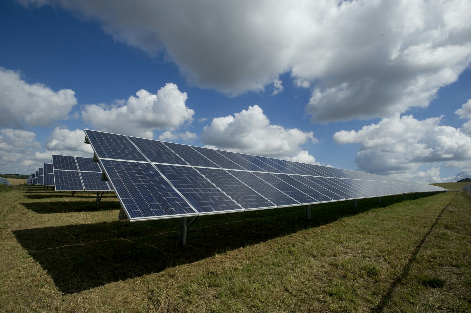 Rooftop solar panels installed on an Indian residential building with blue sky, representing solar EPC work