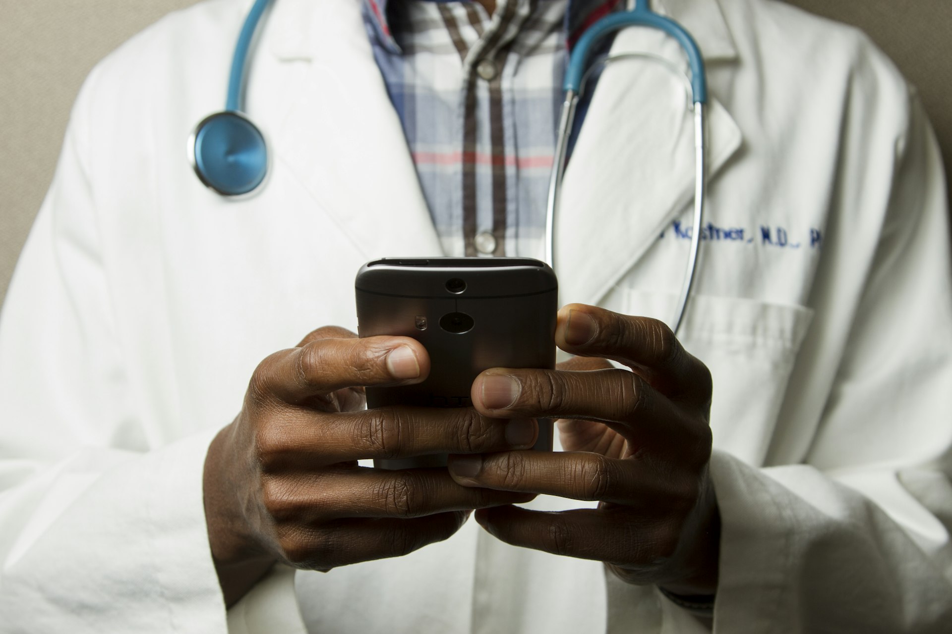 Indian clinician reviewing a patient chart in a multi-specialty clinic — Wendesk Healthcare CRM